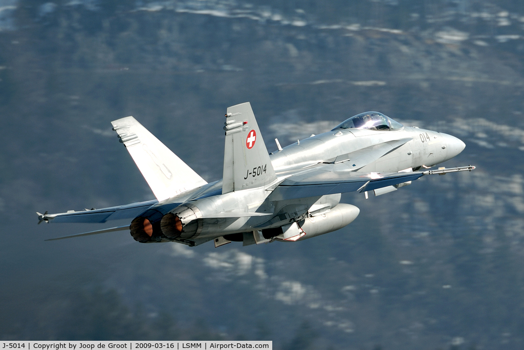 J-5014, McDonnell Douglas F/A-18C Hornet C/N 1359, After take off the aircraft roar over the town of Meiringen. The protests against the noice are growing