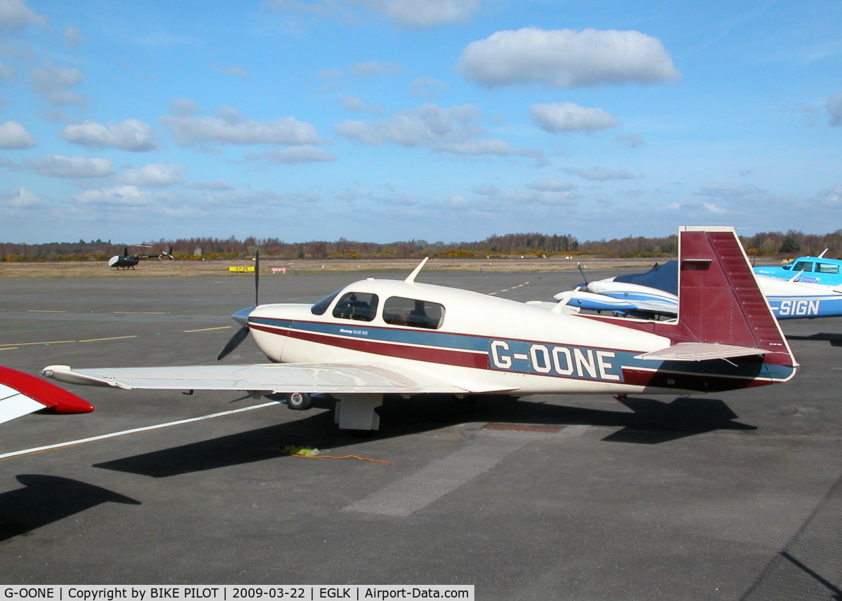 G-OONE, 1987 Mooney M20J 201 C/N 24-3039, PARKED ON THE TERMINAL APRON LOOKING GOOD IN THE SUN