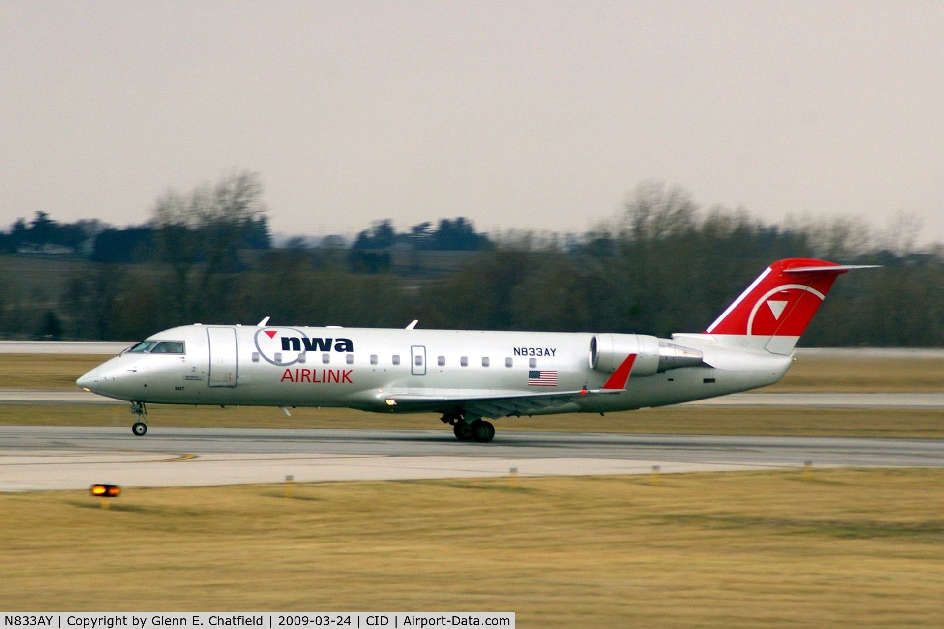 N833AY, 2005 Bombardier CRJ-200LR (CL-600-2B19) C/N 8033, Departing Runway 13 for CVG, light rain