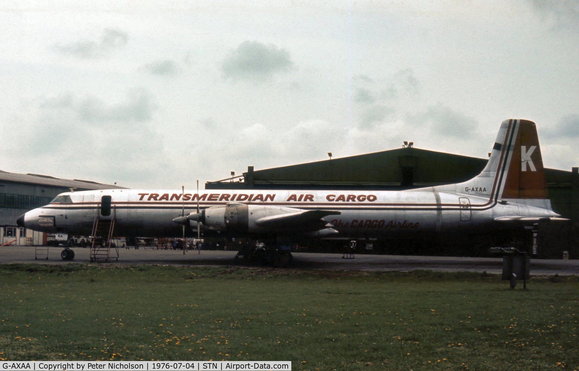 G-AXAA, 1960 Canadair CL-44D4-2 C/N 18, One of Transmeridian's CL-44D4's at their home base in the Summer of 1976.