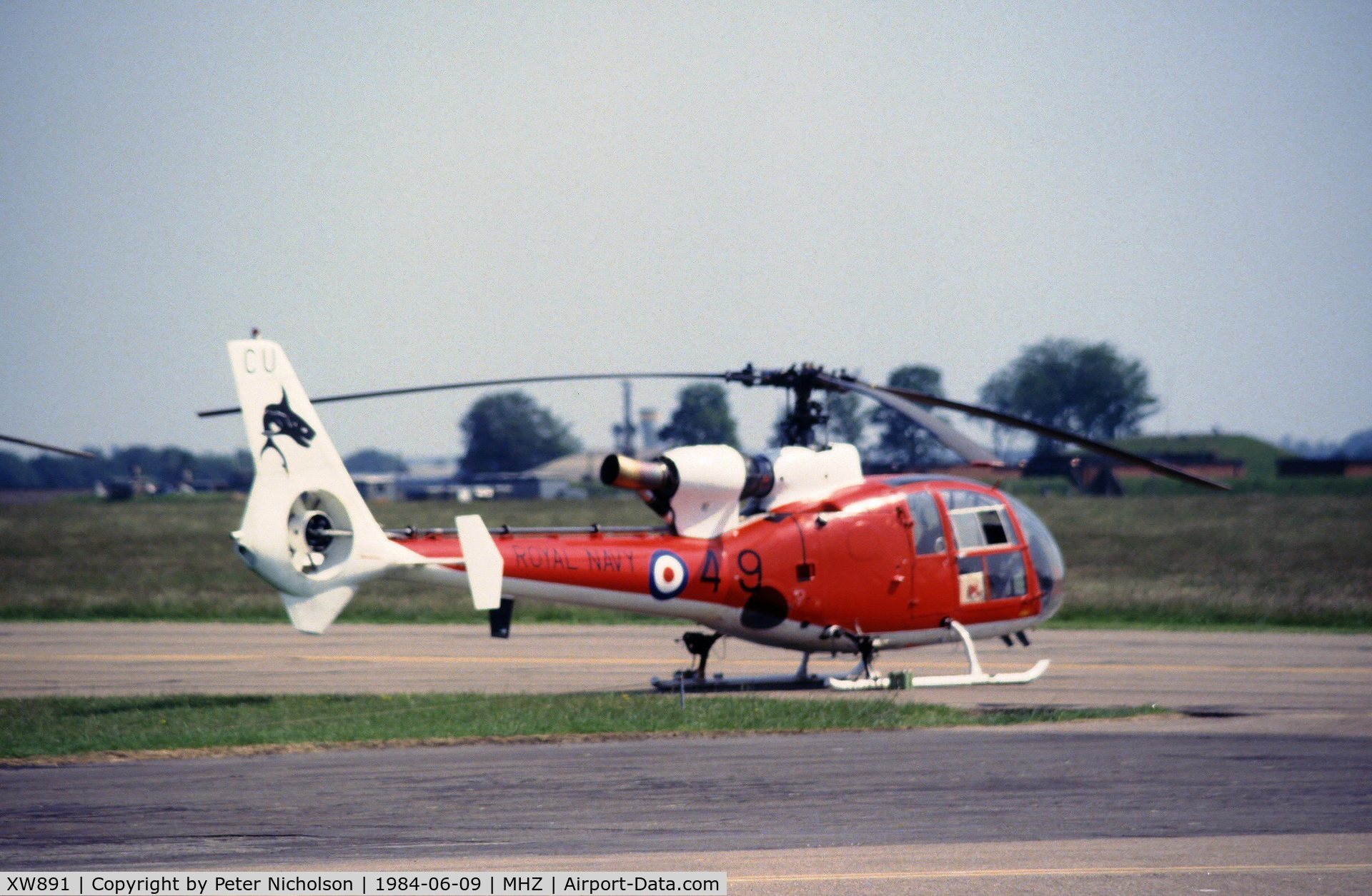 XW891, 1974 Westland SA-341C Gazelle HT2 C/N 1163, Gazelle HT.2 of The Sharks aerobatic display team flown by 705 Squadron at the 1984 RAF Mildenhall Air Fete.