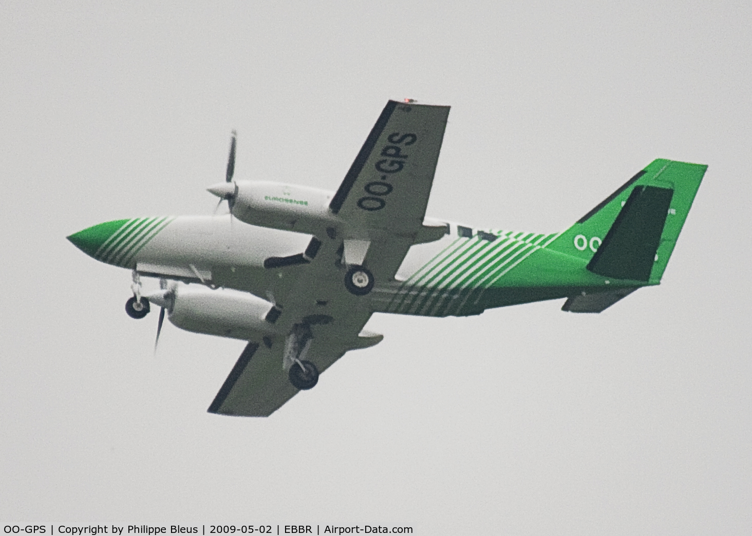 OO-GPS, 1980 Cessna 404 Titan Titan C/N 404-0609, This green little twin turbo prop is mainly used for geo-information. Rising from rwy 25R aon a gloomy morning.