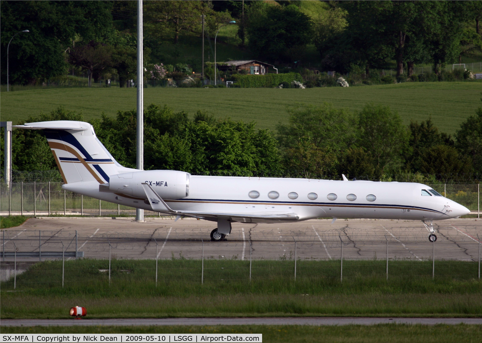SX-MFA, 2007 Gulfstream Aerospace V-SP G550 C/N 5197, LSGG Parked in parking lot P48 which is across the field from the park on the French side (EBACE 2009)