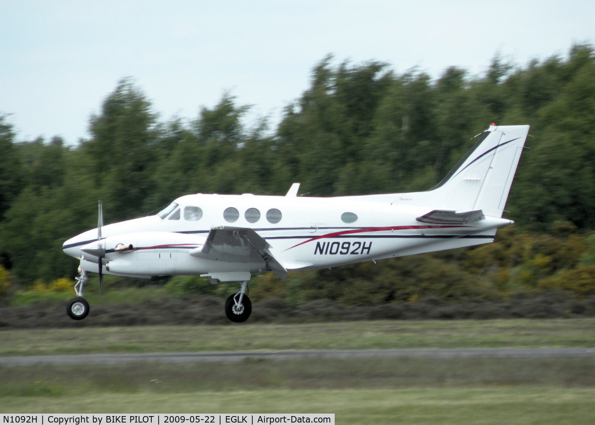 N1092H, 1996 Raytheon C90A King Air C/N LJ-1454, ABOUT TO TOUCH DOWN ON RWY 25