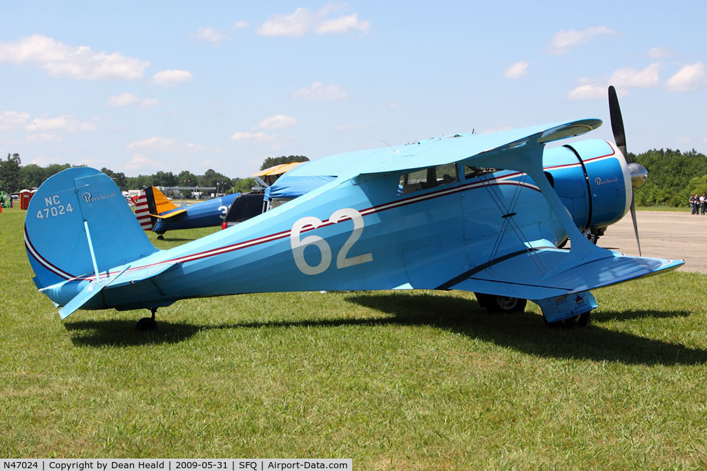 N47024, 1928 Beech C17B C/N C17B-102, 1936 Beechcraft C17B Staggerwing NC47024 at the 2009 Virginia Regional Festival of Flight at Suffolk Executive Airport. Seen here in the Olive Ann Beech and Louise Thaden colors, based on the 1936 Sherwin-Williams Airplane Finishing specifications.