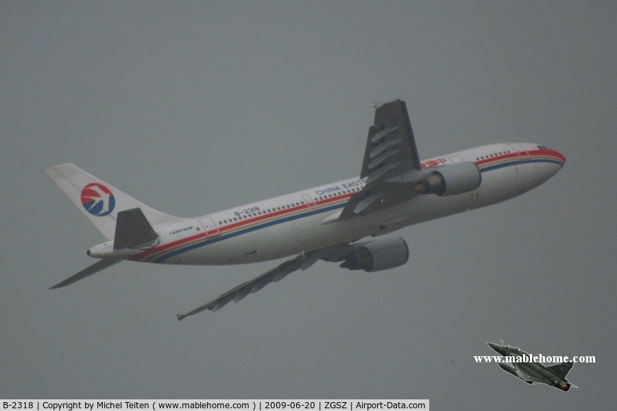 B-2318, 1993 Airbus A300B4-605R C/N 707, China Eastern Airlines taking off during a summer thunderstorm