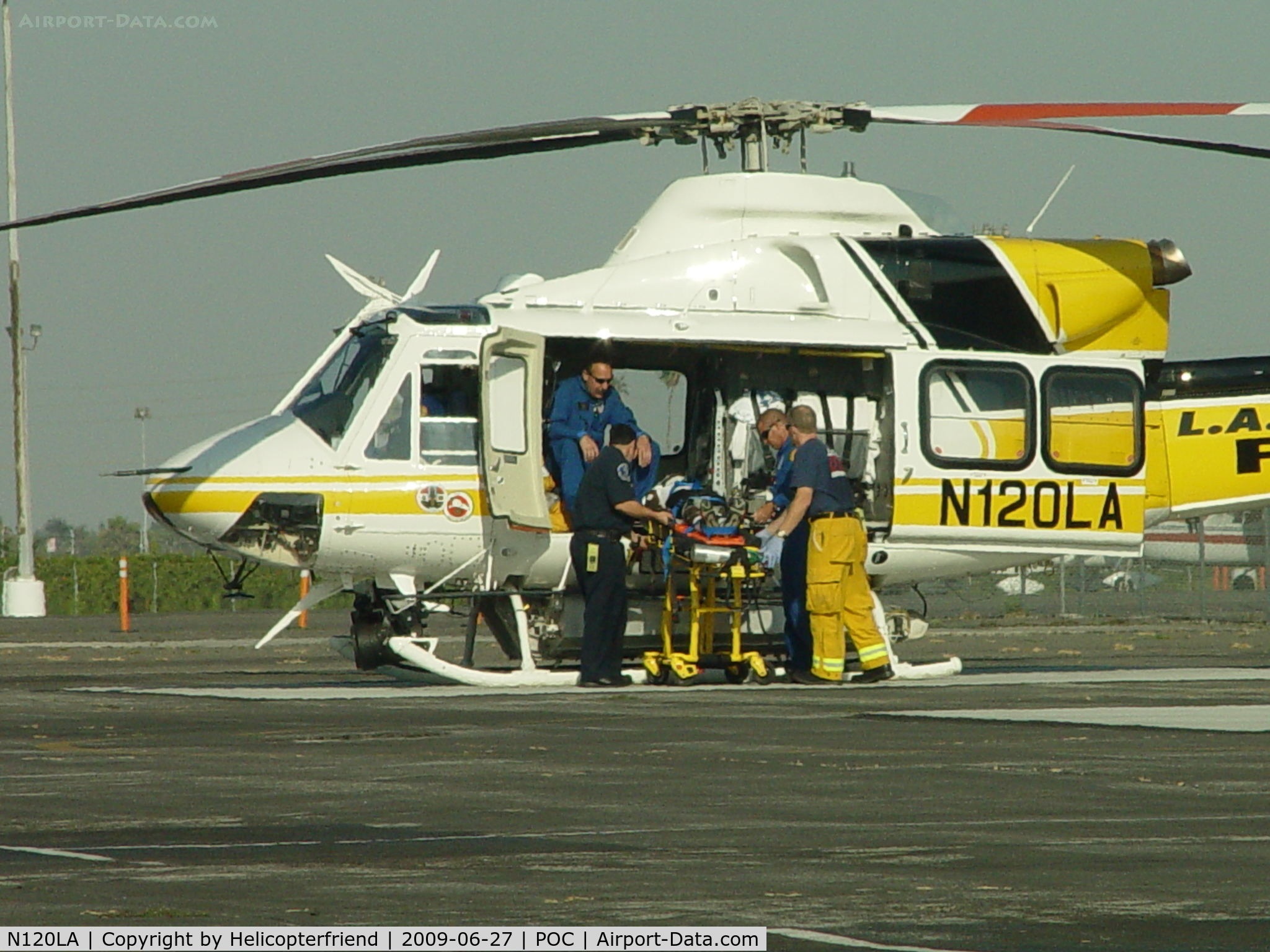 N120LA, 2007 Bell 412EP C/N 36455, Patient being placed on board for transportation