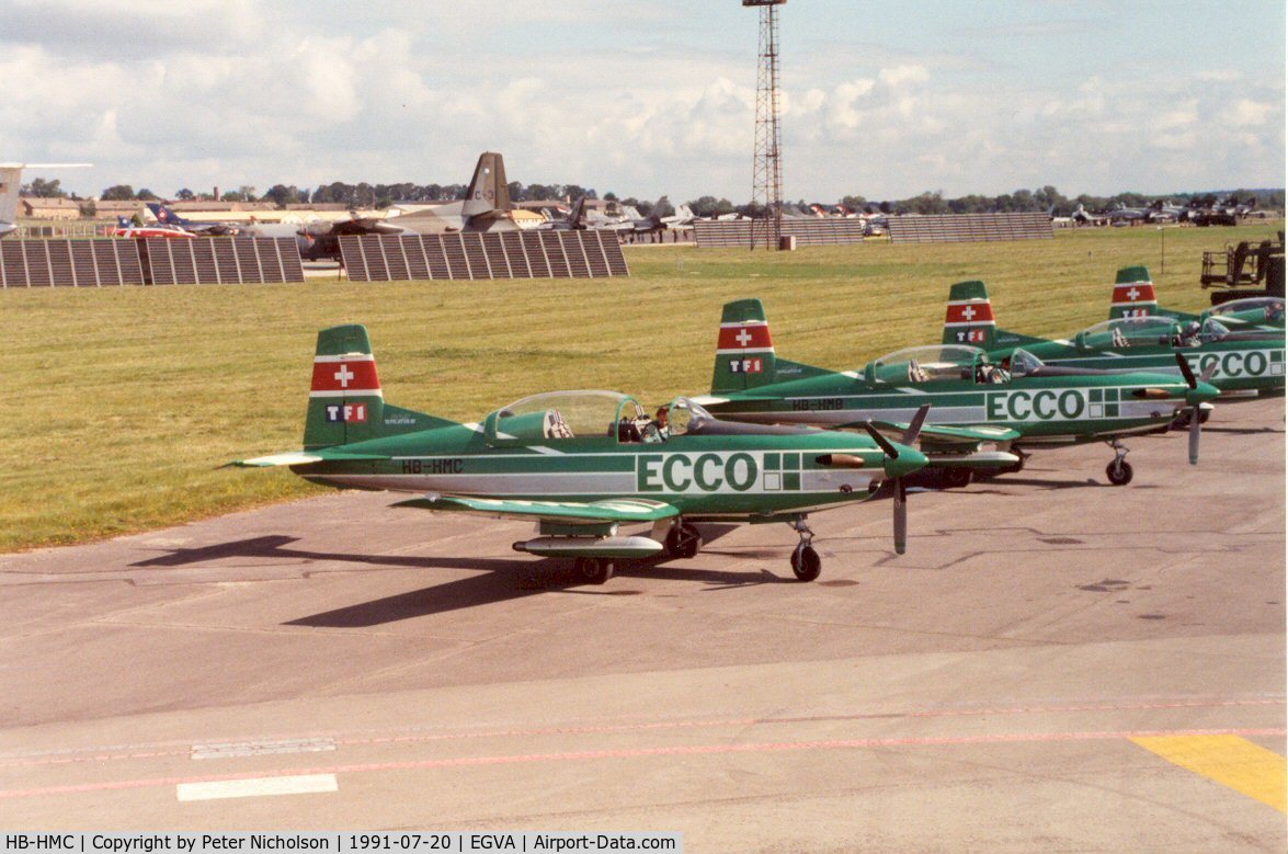HB-HMC, Pilatus PC-7 Turbo Trainer C/N 521, Pilatus PC-7 of Team Ecco with other team aircraft at the 1991 Intnl Air Tattoo at RAF Fairford.
