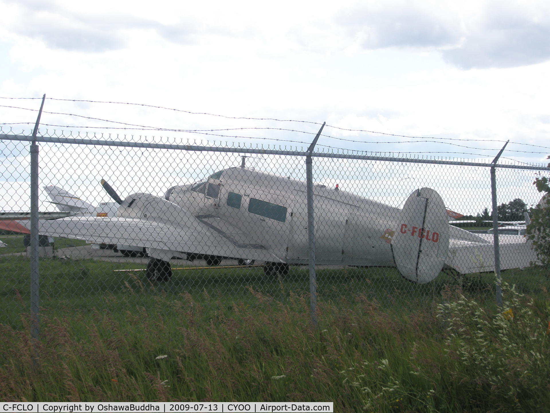 C-FCLO, 1956 Beech E18S-9700 C/N BA-143, Not a great shot - Parked in front of Enterprise Air Oshawa