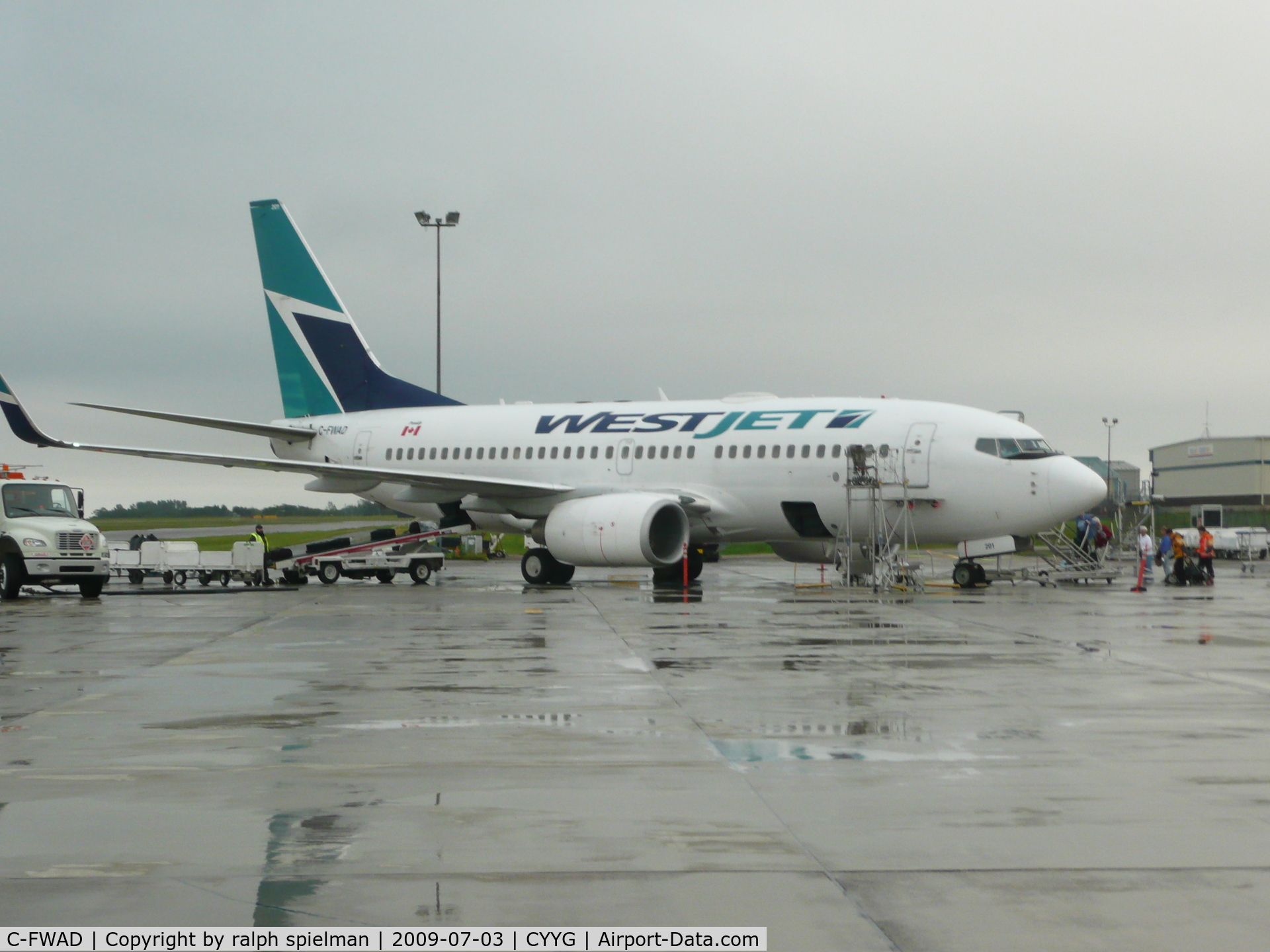 C-FWAD, 2002 Boeing 737-7CT C/N 32753, Aircraft in Charlottetown, PE on a rainy day