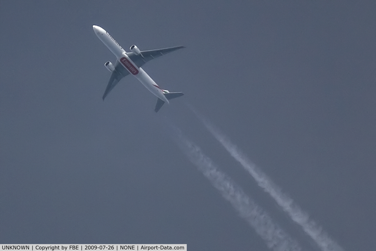UNKNOWN, Contrails Various C/N Unknown, Emirates Triple Seven cruises high over EDDF