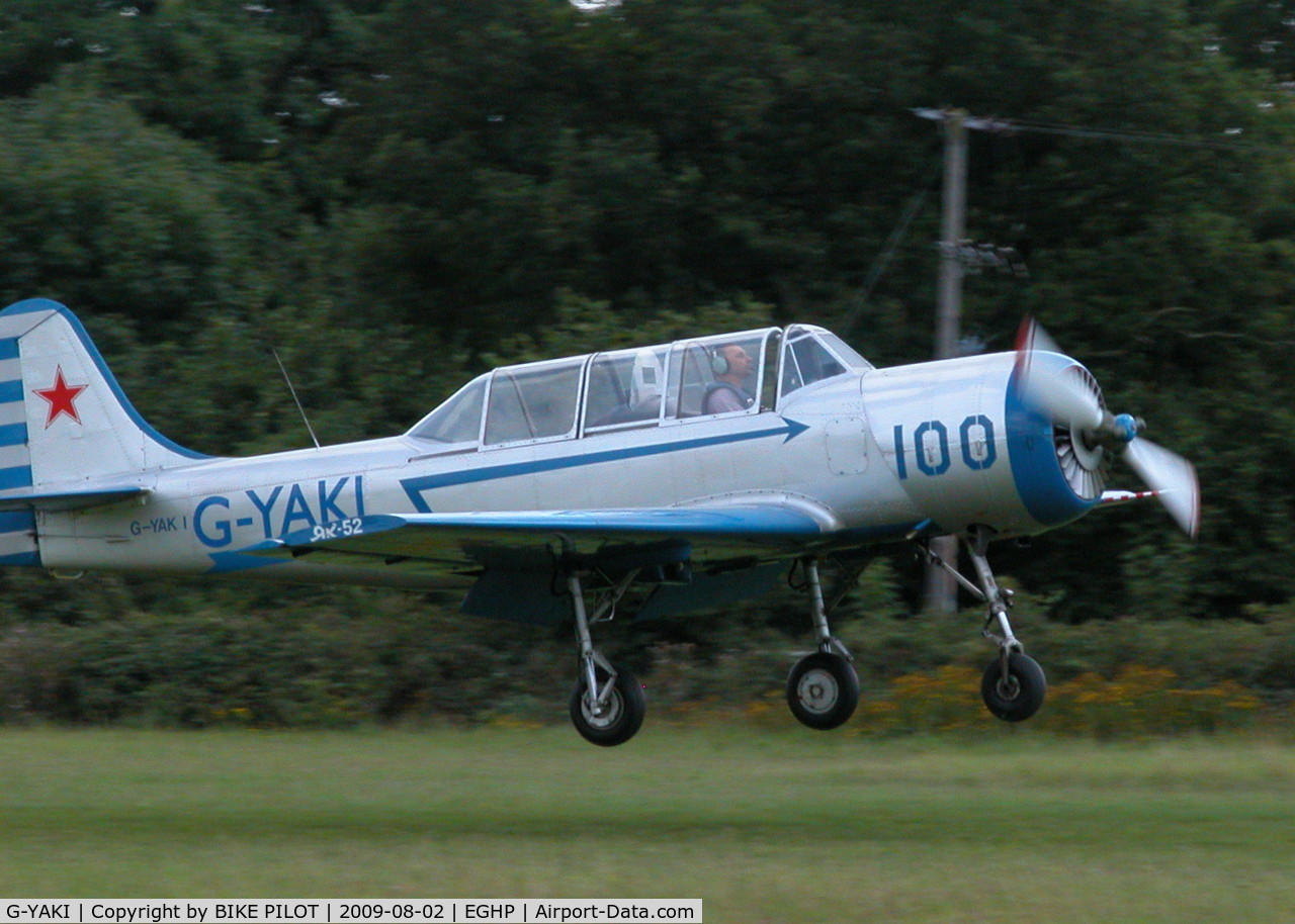 G-YAKI, 1986 Bacau Yak-52 C/N 866904, ABOUT TO TOUCH DOWN ON 26