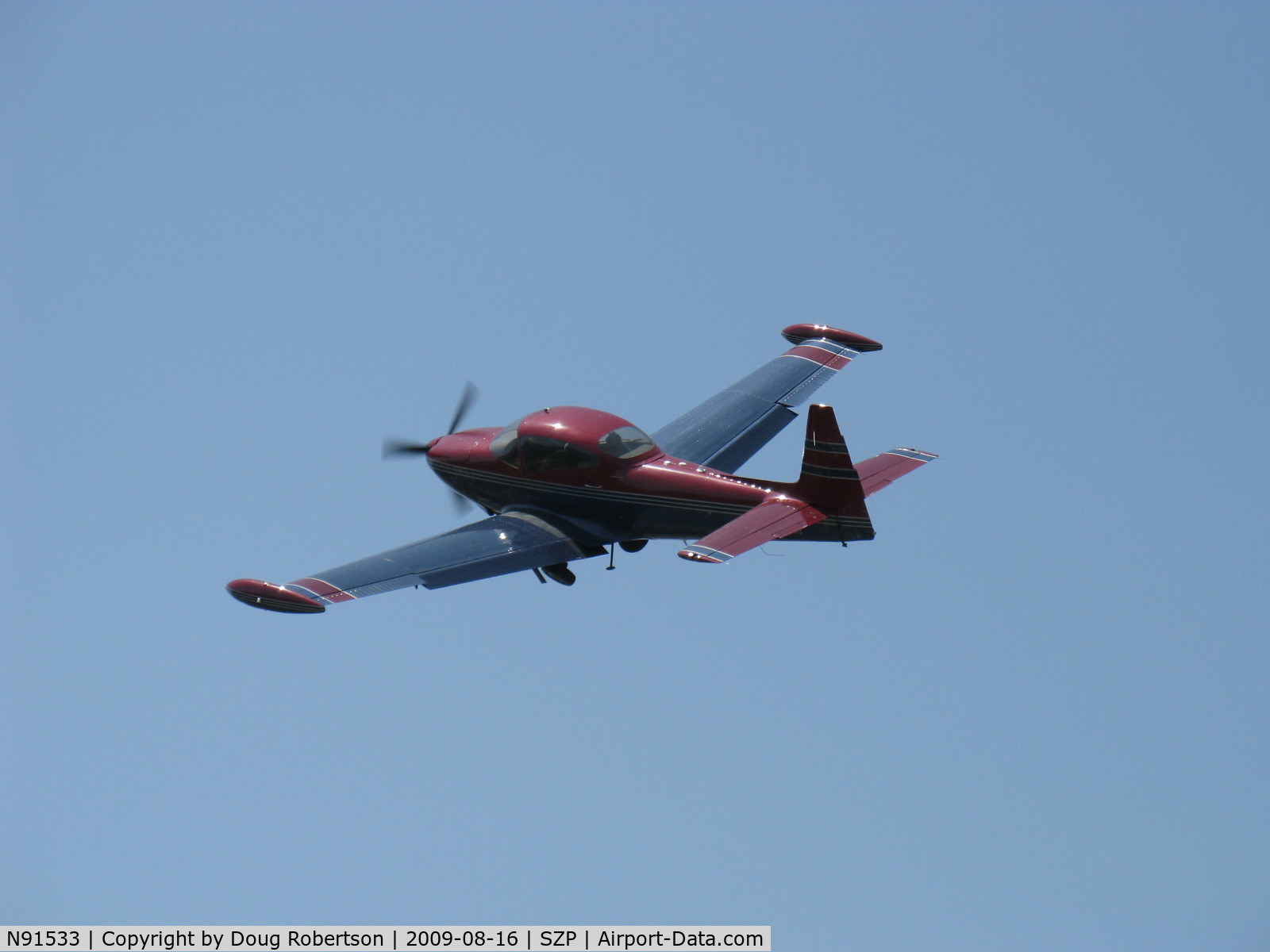 N91533, 1946 North American Navion C/N NAV-4-129, 1946 North American NAVION, Continental E-185-3 185 Hp listed, fast climbing departure turn from Rwy 22. Performance, prop and cowl mods suggest higher horsepower engine upgrade. See prior photo taken 3 seconds earlier.