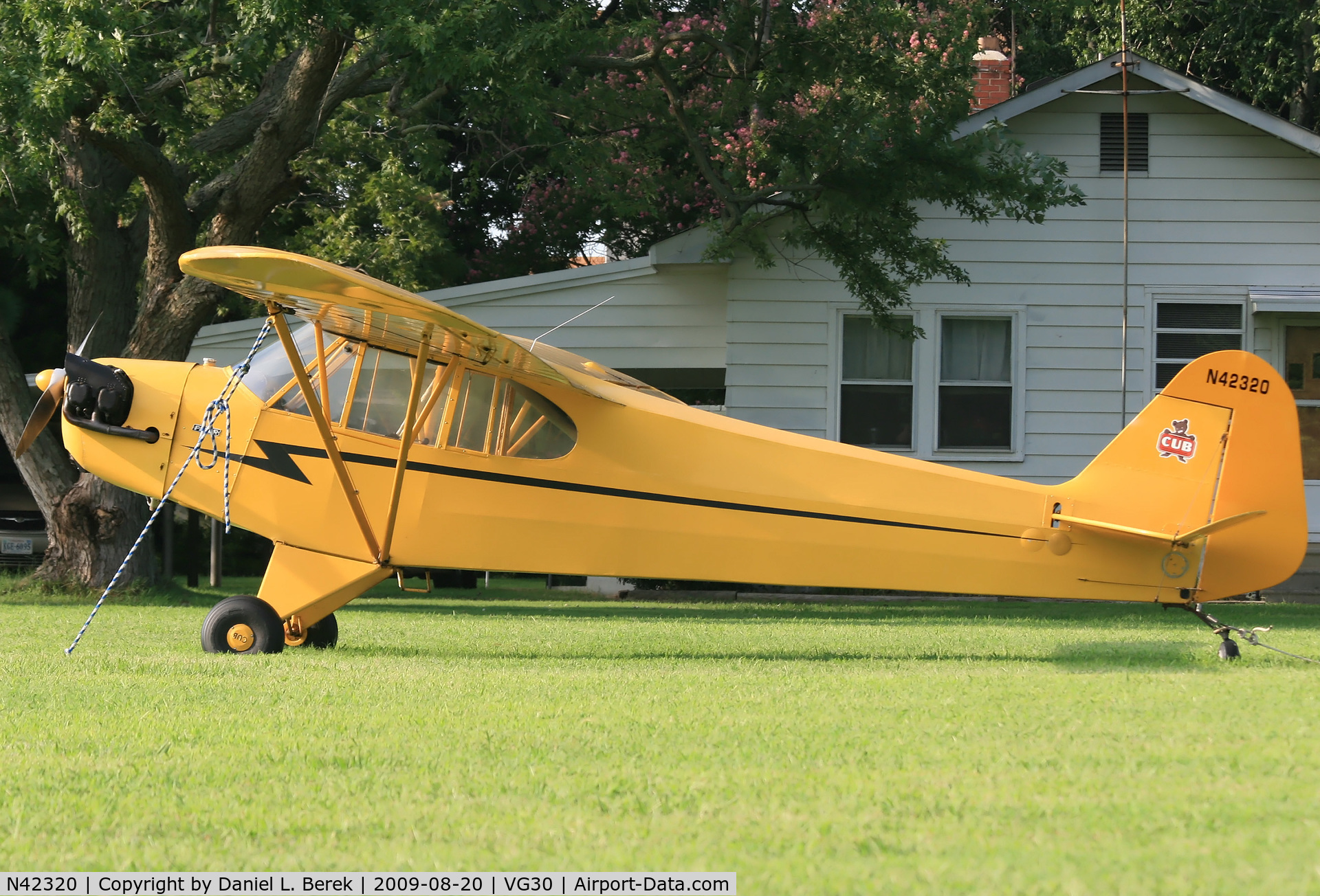 N42320, 1945 Piper J3C-65 Cub C/N 14570, Some people have a fancy car parked in front of their house, while others have something much more interesting.  I found this 1945 Piper Cub at Scotts Farm Airport, Cape Charles, VA.