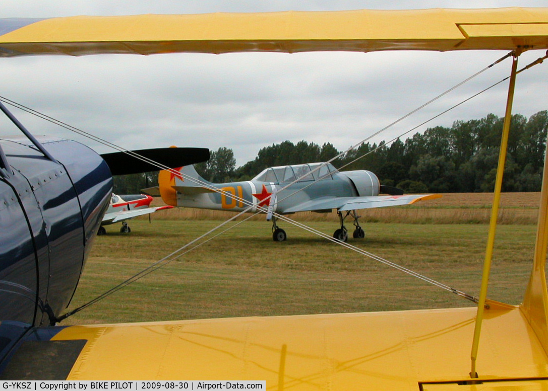 G-YKSZ, 1993 Yakovlev (Aerostar) Yak-52 C/N 9311709, SIERRA ZULU FRAMED BY STEEN SKYBOLY G-ENGO. BRIMPTON FLY-IN