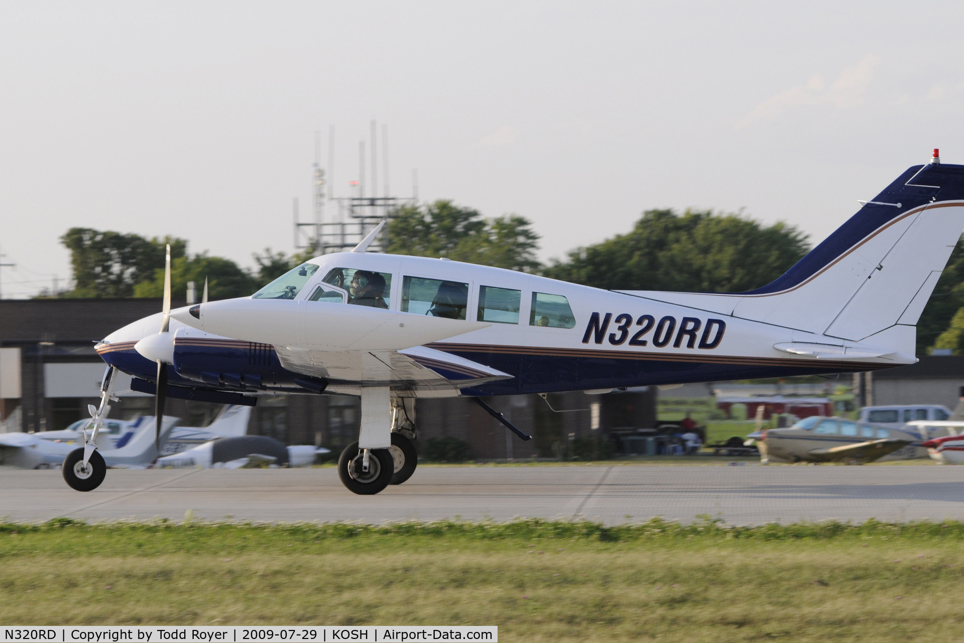 N320RD, 1963 Cessna 320B Skyknight C/N 320B0035, Departing OSH on 27