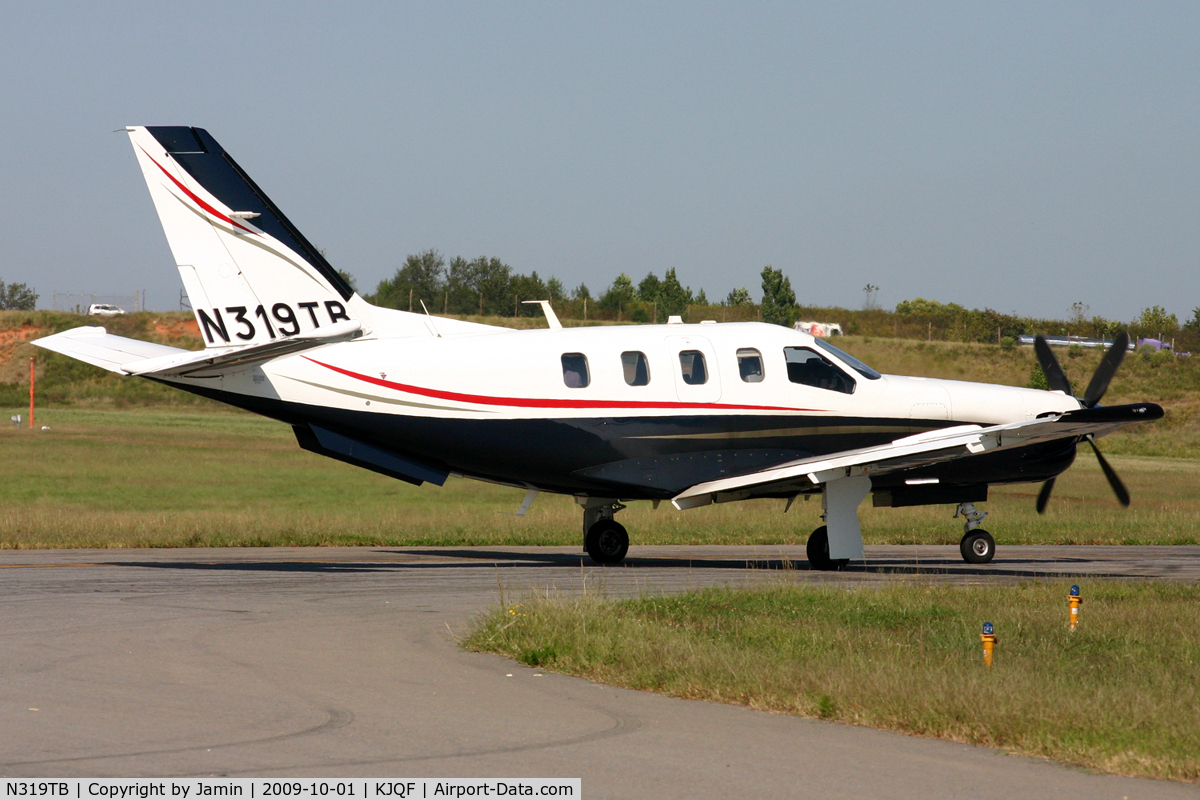 N319TB, 2005 Socata TBM-700 C/N 319, Holding short of runway 20 prior to departure.