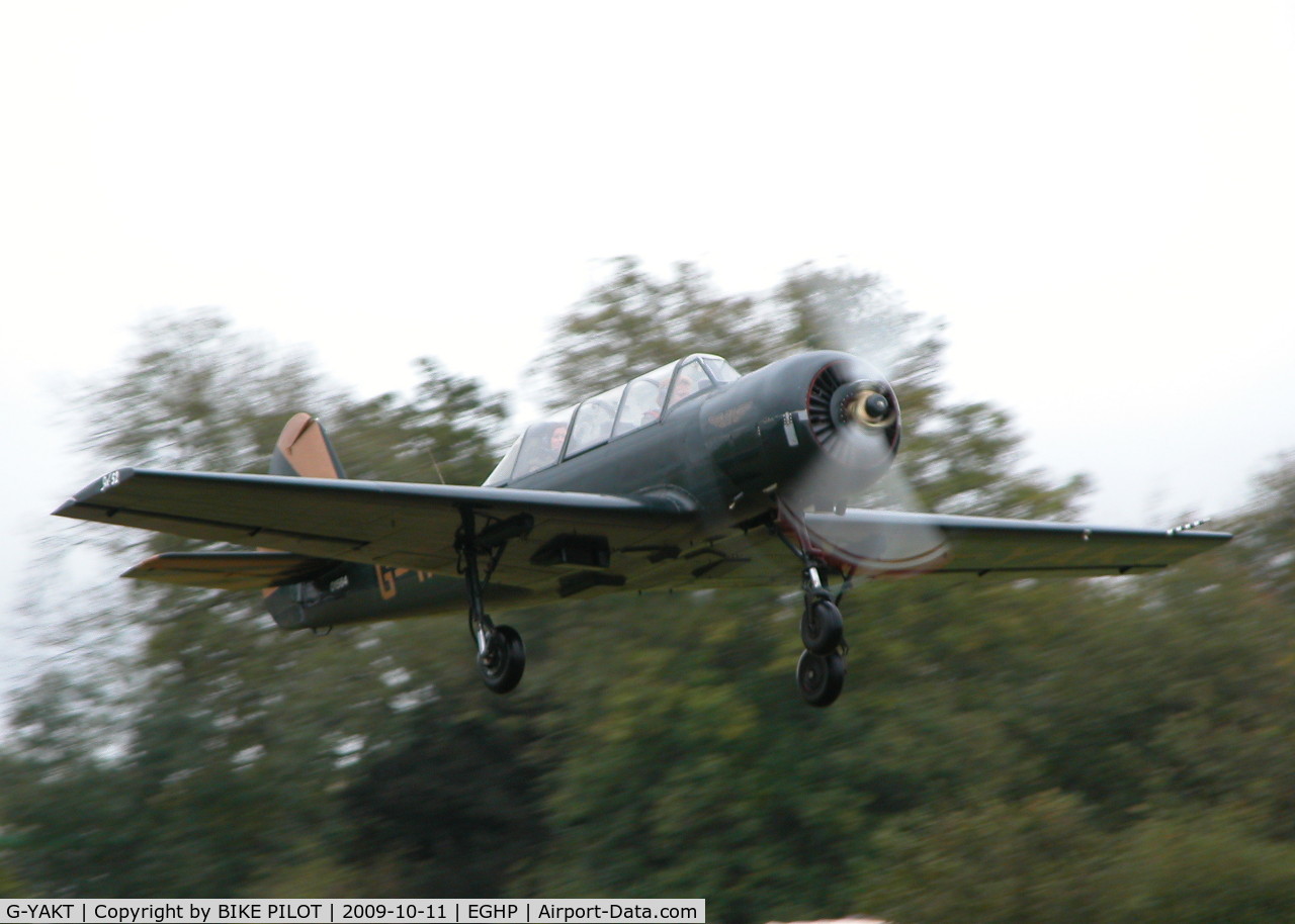 G-YAKT, 1989 Bacau Yak-52 C/N 8910302, CLIMBING AWAY FROM RWY 26