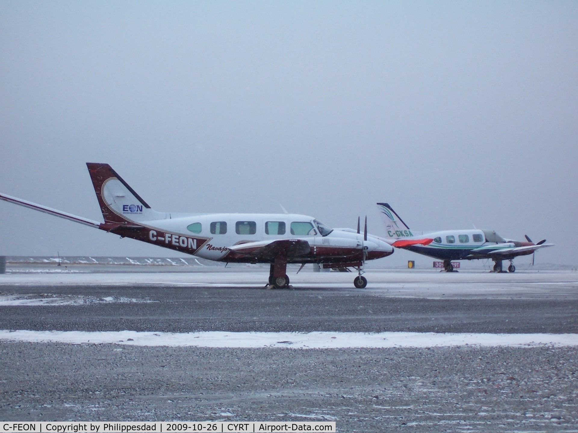 C-FEON, 1974 Piper PA-31 C/N 31-7401249, C-FEON at Rankin Inlet, NU 2009oct26 with C-GKSA in background