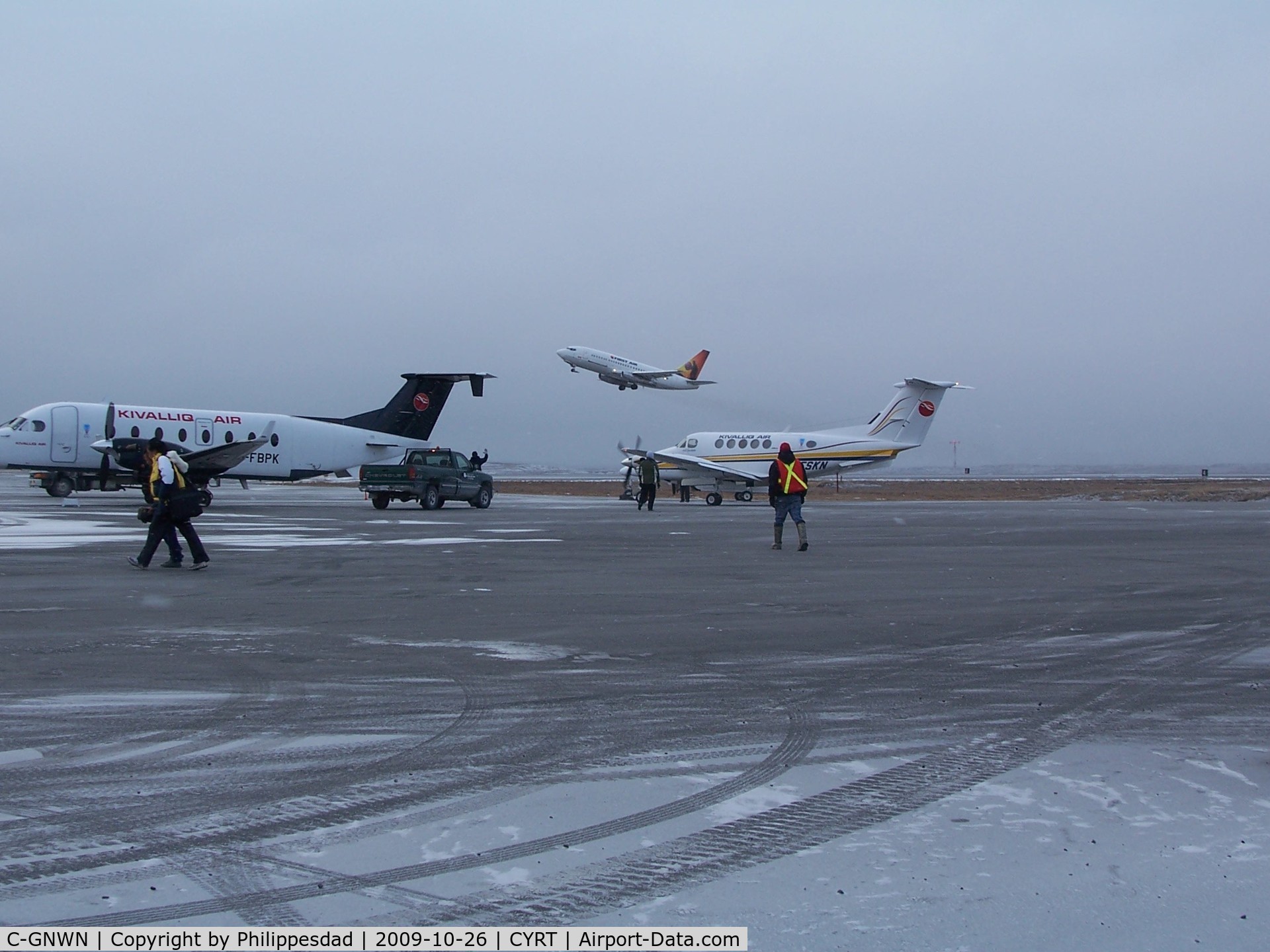 C-GNWN, Boeing 737-210C C/N 21067, C-GNWN taking off, Rankin Inlet, NU  2009oct26 with C-FSKN and C-FBPK in foreground