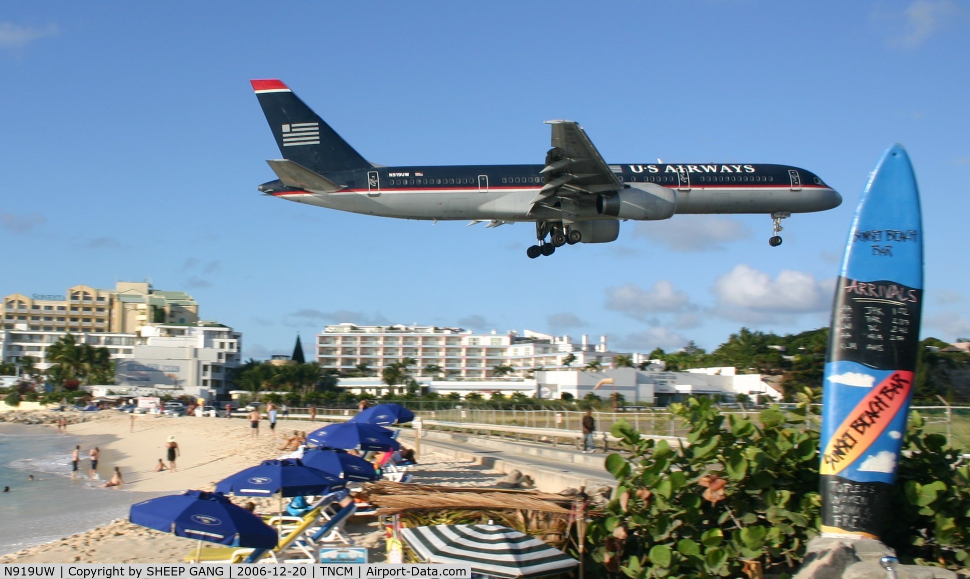 N919UW, 1982 Boeing 757-225 C/N 22198, landing at tncm. with the sufboard of sunset beach bar in the forground