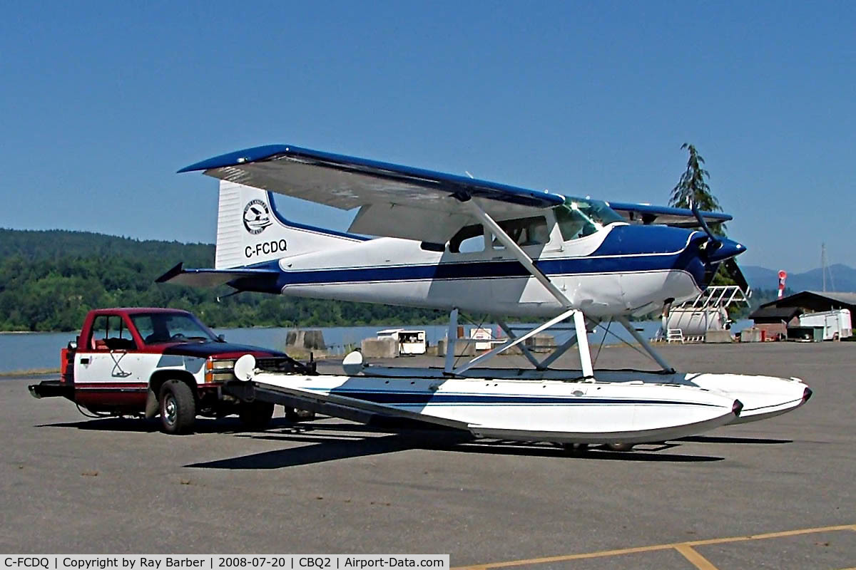 C-FCDQ, 1970 Cessna 180H Skywagon C/N 18052166, Seen being towed out for fueling at Fort Langley before departure on the Fraser River. Note the adapted vehicle used for the floatplanes at the base.