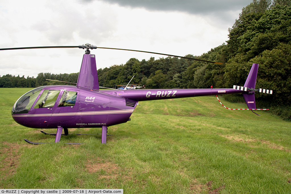 G-RUZZ, 2003 Robinson R44 Raven II C/N 10082, seen @ Cholmondeley