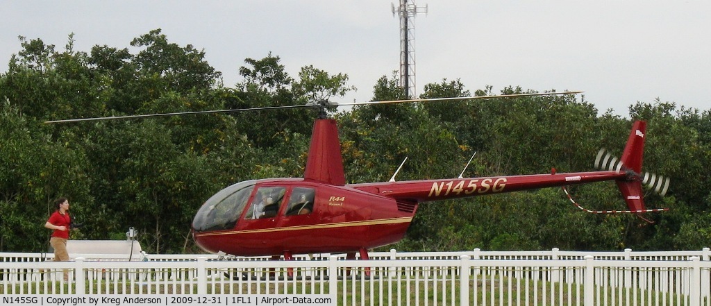 N145SG, 2005 Robinson R44 C/N 1494, Giving tours at the Orlando Helicenter along Irlo Bronson Highway in Kissimmee, FL.