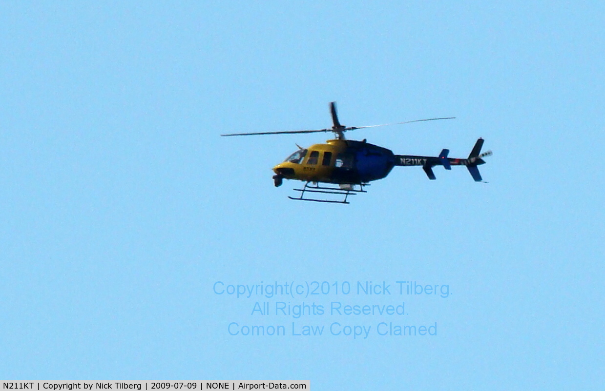 N211KT, 1997 Bell 407 C/N 53162, Late afternoon circling the Western Washington Fairgrounds in Puyallup WA