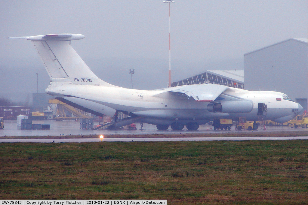 EW-78843, 1990 Ilyushin Il-76TD C/N 1003403082, A rather murky image of Trans Avia Export Cargo's IL-76 being loaded in pouring rain at EMA with supplies for the Haiti Relief effort