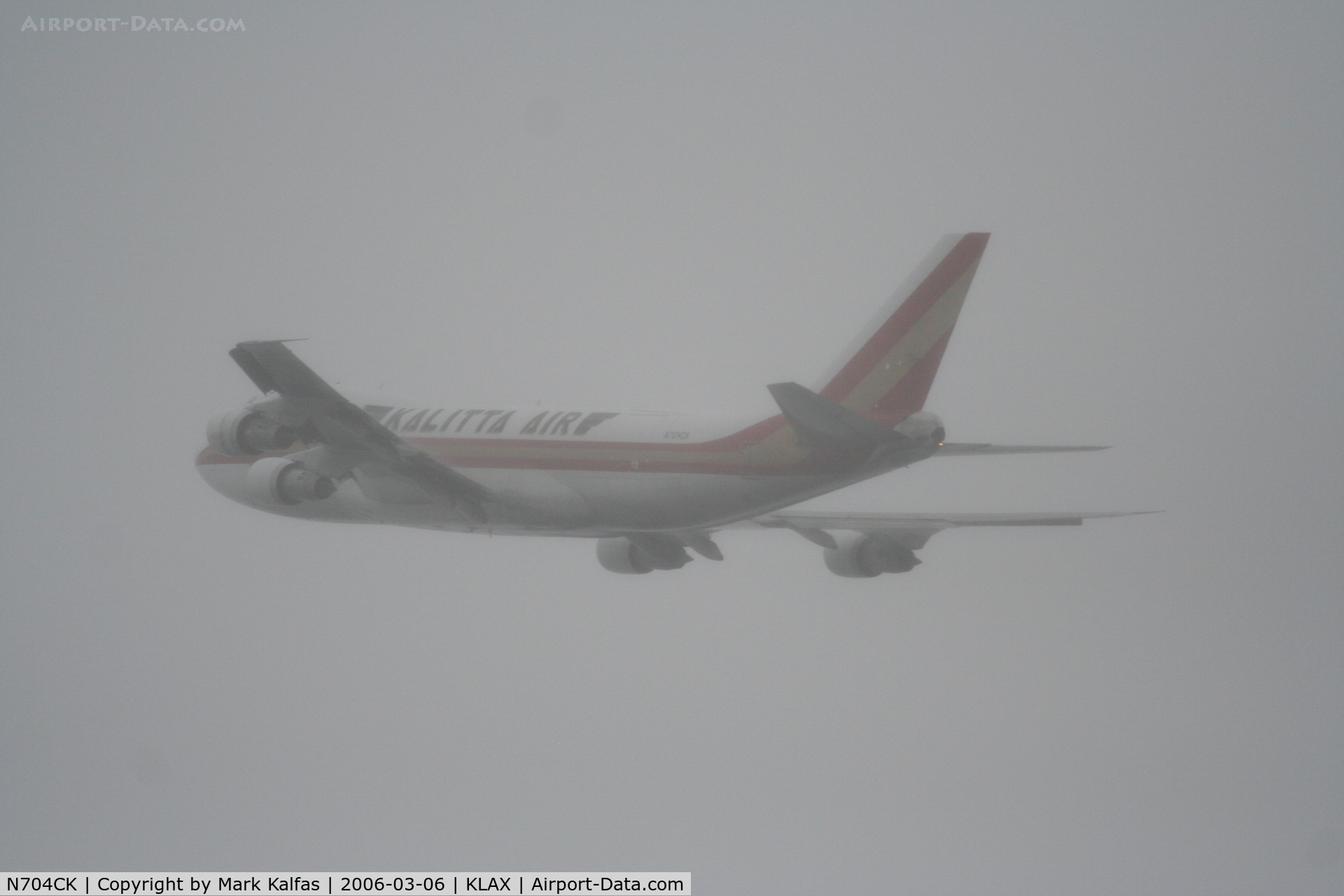 N704CK, 1980 Boeing 747-209F C/N 22299, Kalitta Air Boeing 747-209F, blasting through the fog, 25L departure KLAX.