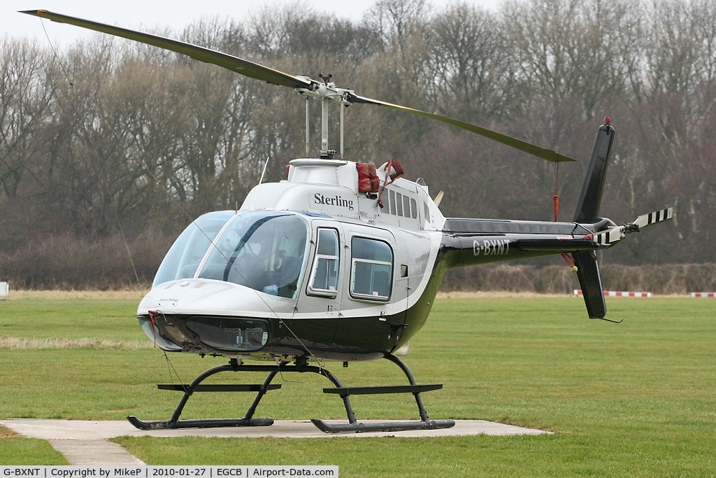 G-BXNT, 1977 Bell 206B JetRanger III C/N 2398, Parked up on a grey Manchester day.