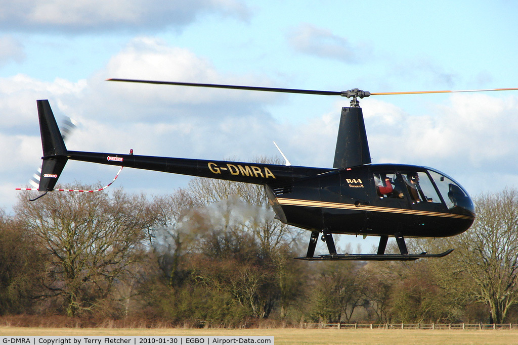 G-DMRA, 2007 Robinson R44 Raven II C/N 11802, Part of a busy aviation scene at Wolverhampton (Halfpenny Green) Airport on a crisp winters day