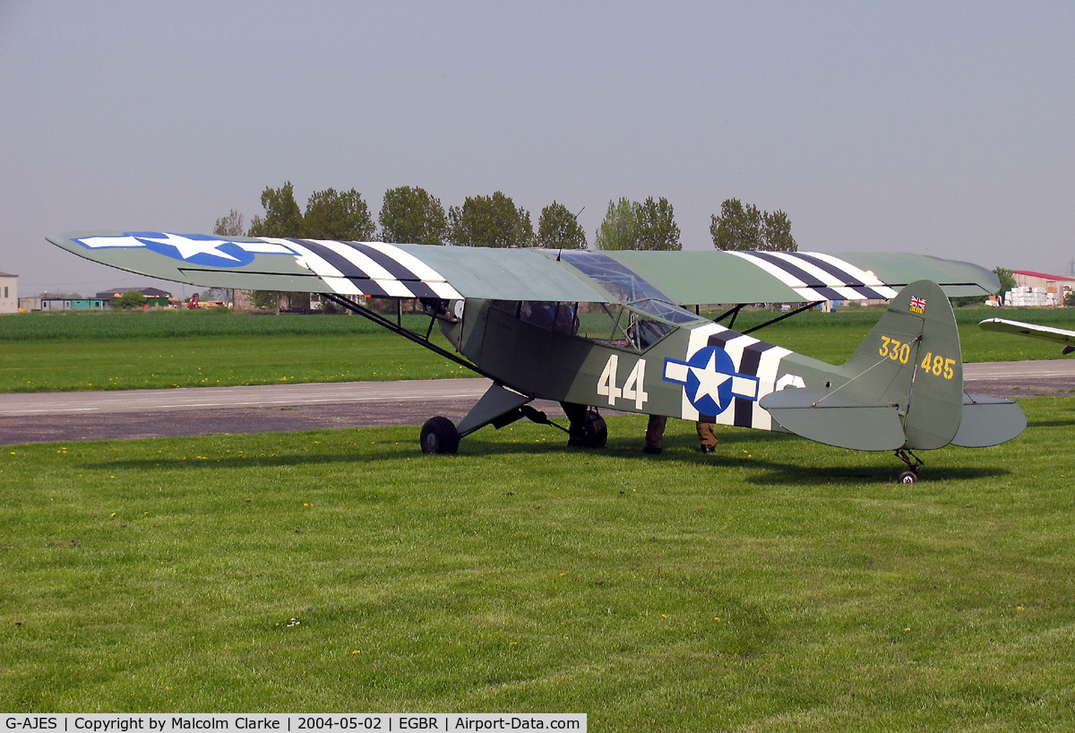 G-AJES, 1943 Piper L-4J Grasshopper (J3C-65D) C/N 11602, Piper L-4J Grasshopper (J-3C-65D). 43-30485 at Breighton's Spring Fly-in in 2004.