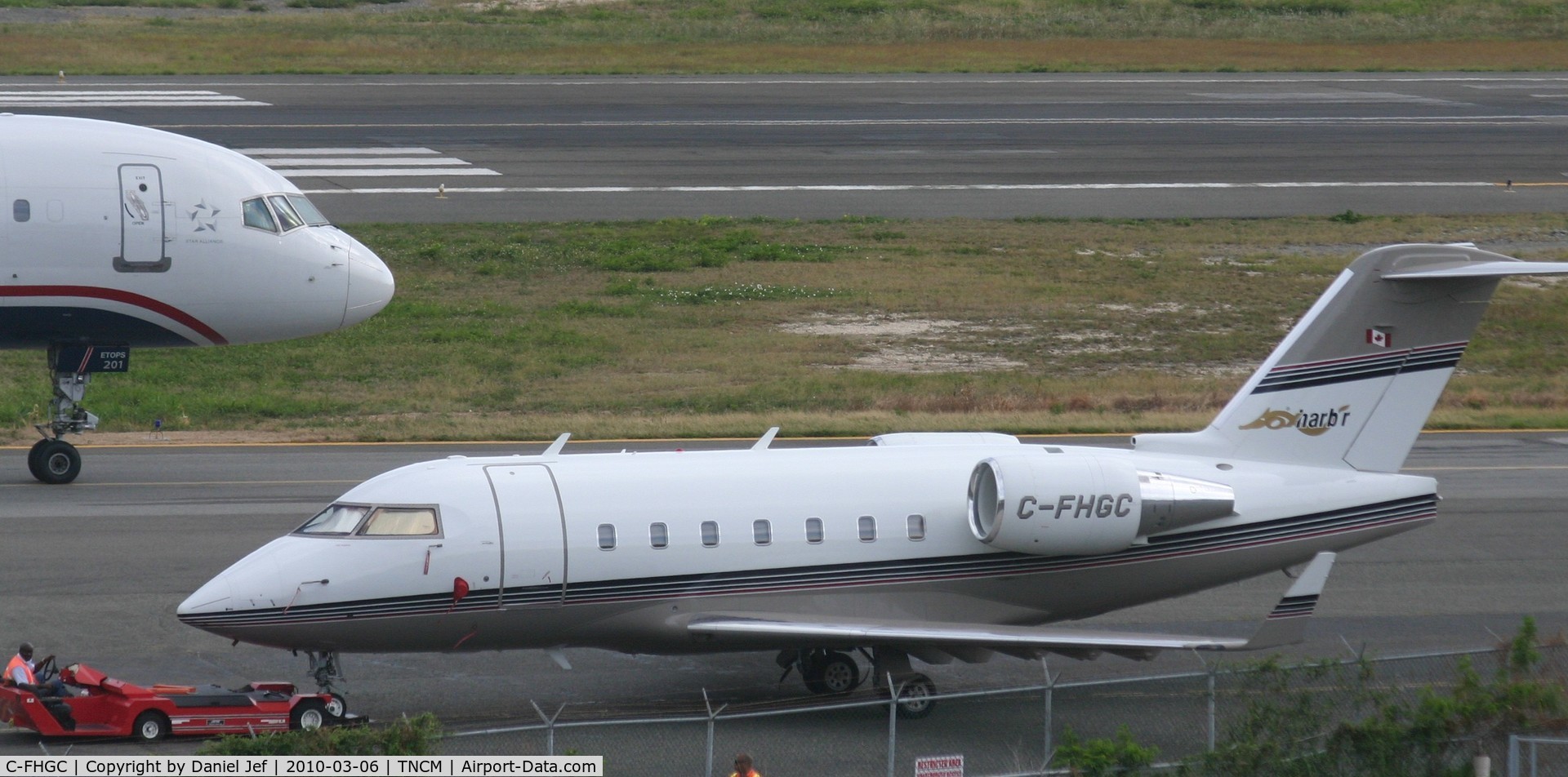 C-FHGC, Canadair Challenger 604 (CL-600-2B16) C/N 5453, C-FHGC BEING TOWED TO ITS PARKING POSITION AT THE CARGO RAMP.