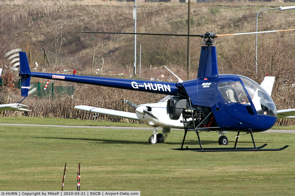 G-HURN, 1990 Robinson R22 Beta C/N 1441, Departing from the pumps.