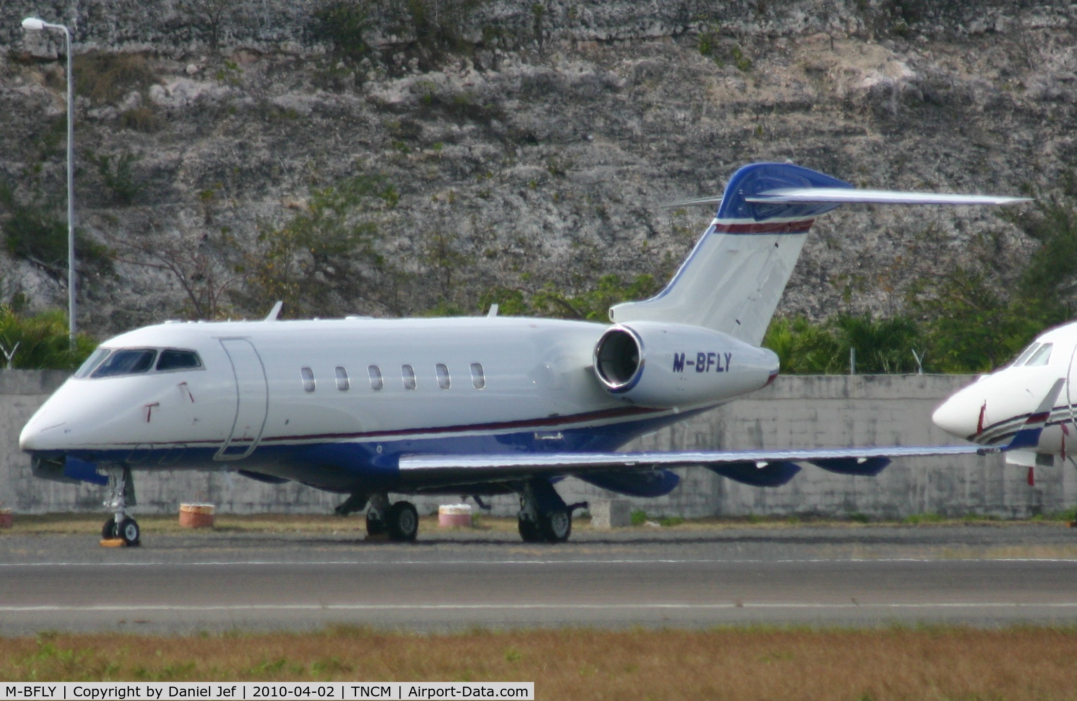 M-BFLY, 2006 Bombardier Challenger 300 (BD-100-1A10) C/N 20123, M-BFLY park at the far west ramp at TNCM