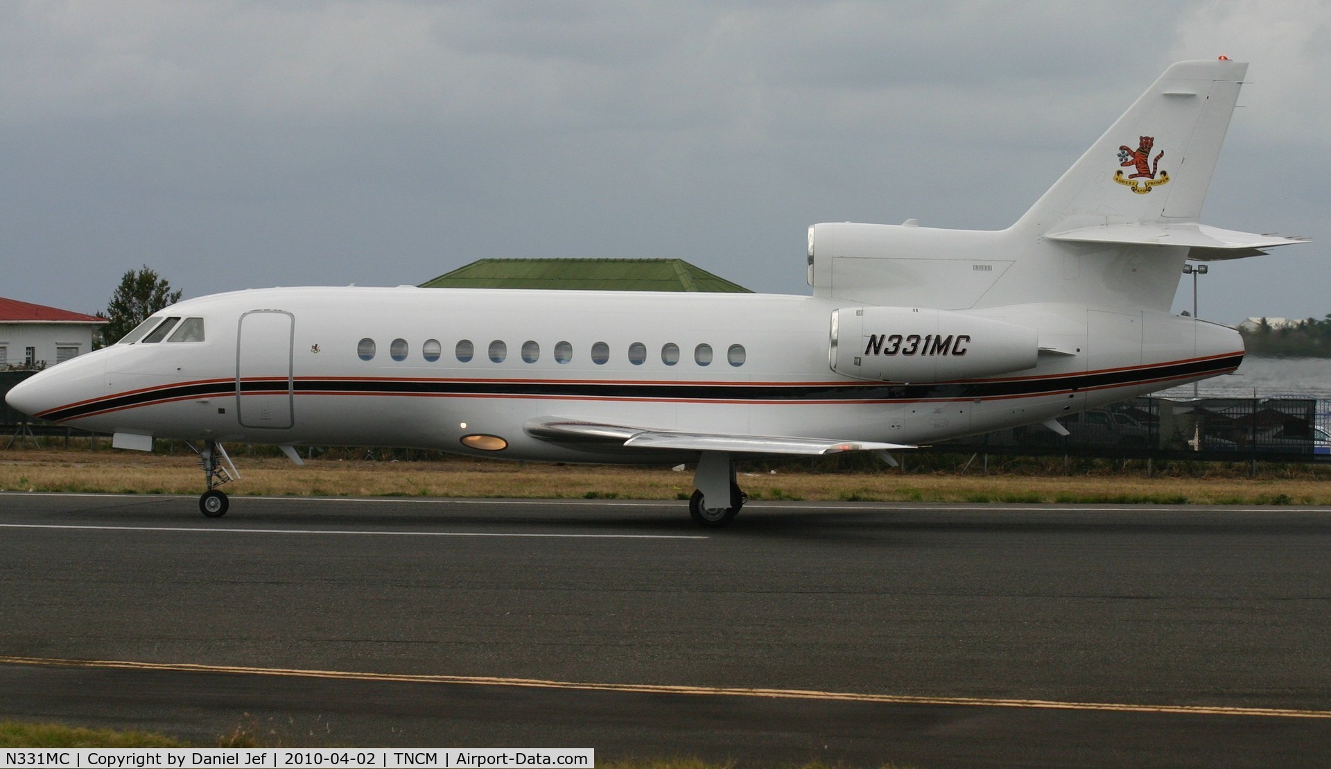 N331MC, 1997 Dassault Falcon 900EX C/N 22, N331MC just landed at TNCM runway 10 now back tracking the active for parking