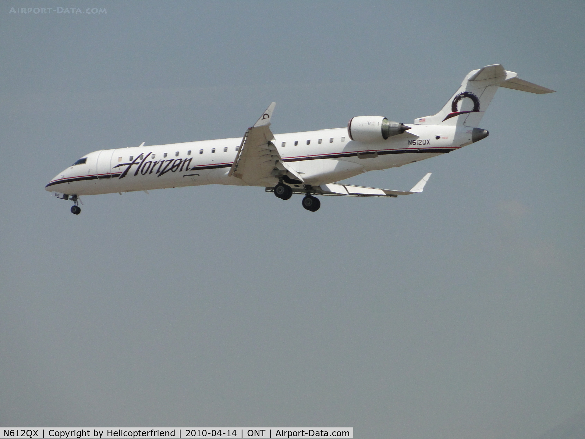 N612QX, 2002 Bombardier CRJ-701 (CL-600-2C10) Regional Jet C/N 10042, On final for runway 26R at Ontario