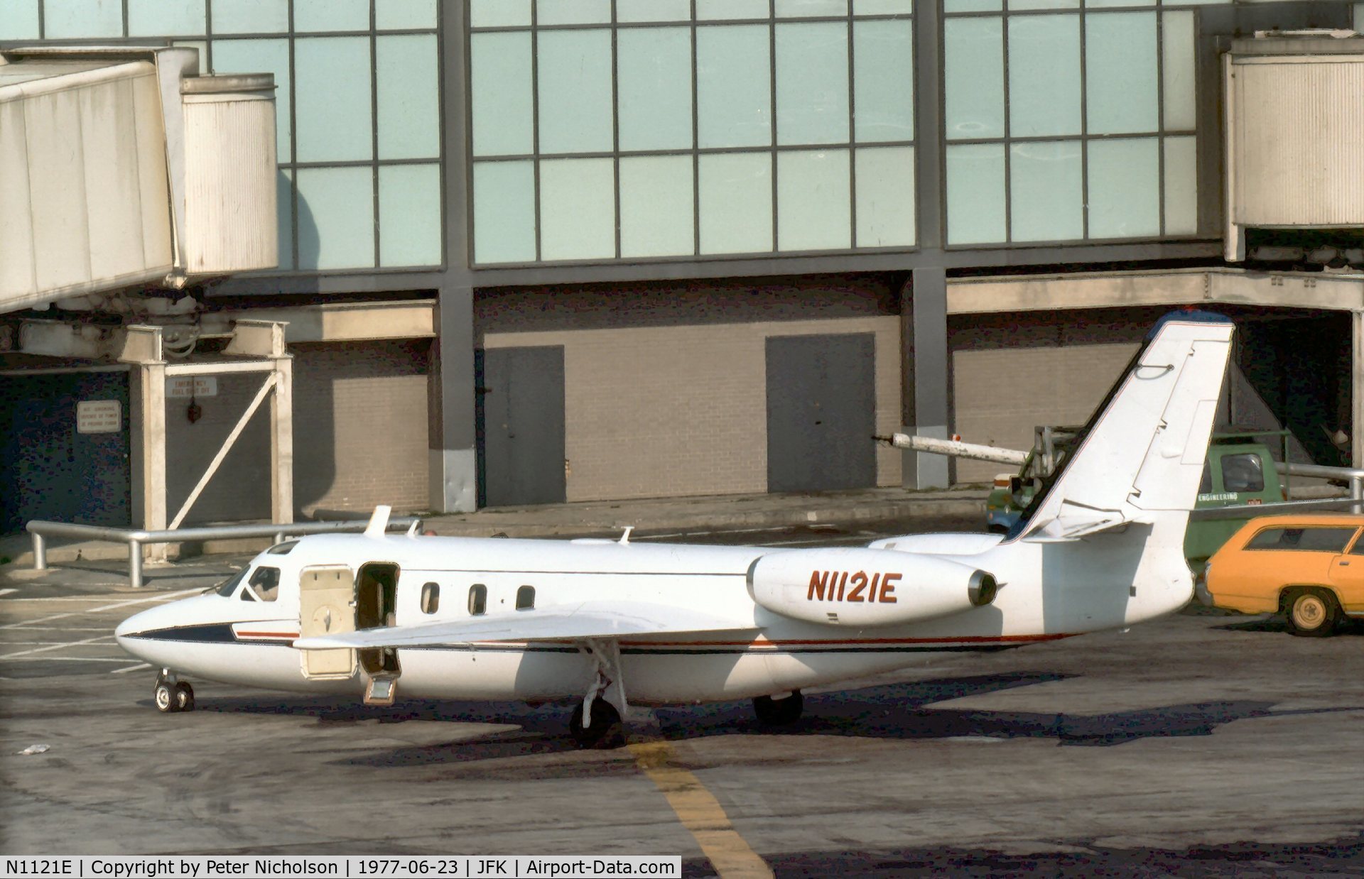 N1121E, 1969 Aero Commander 1121 Jet Commander C/N 20, Jet Commander 1121 parked at the terminal at Kennedy in the Summer of 1977.