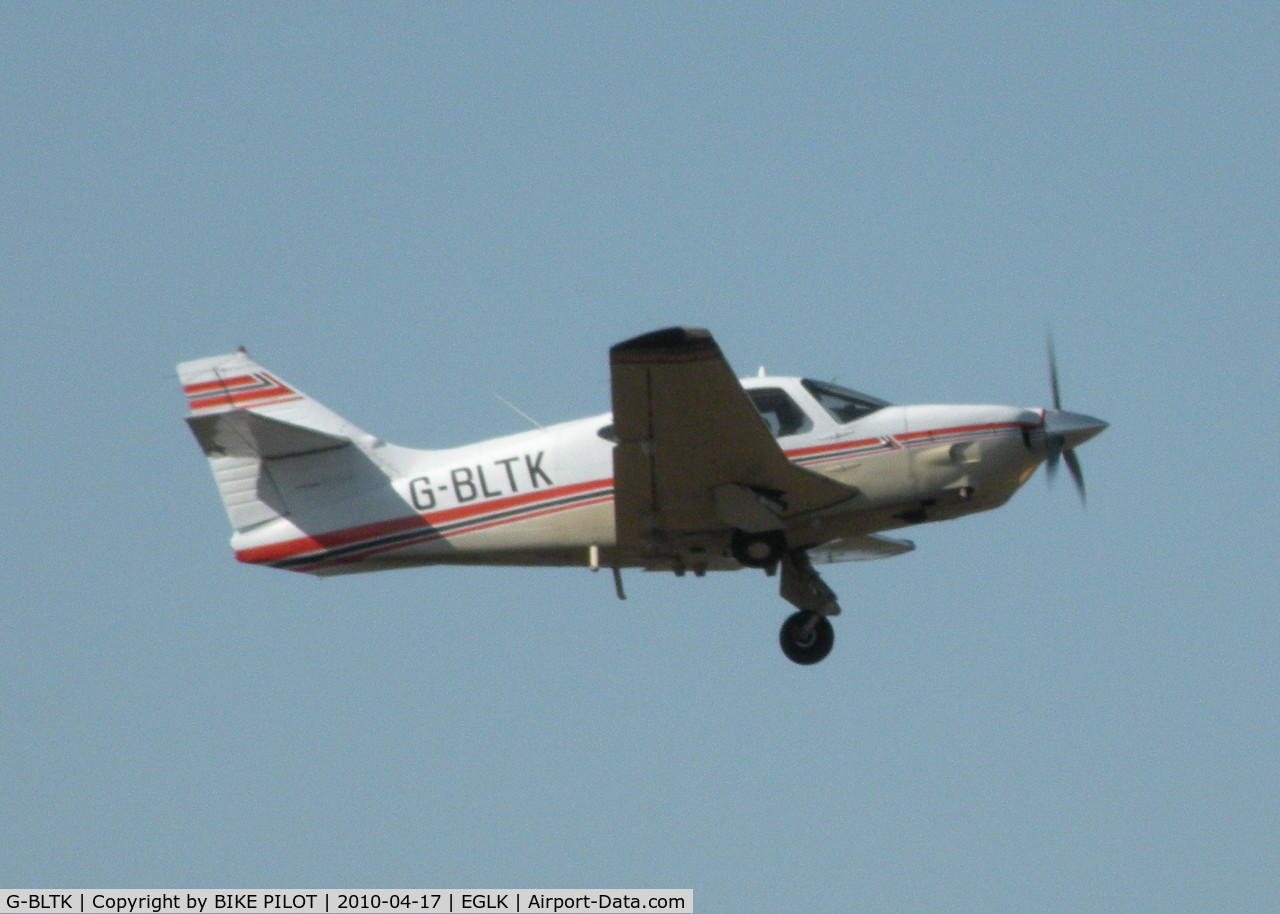 G-BLTK, 1976 Rockwell Commander 112TC C/N 13106, TUCKING THE GEAR UP ON CLIMB OUT FROM RWY 07