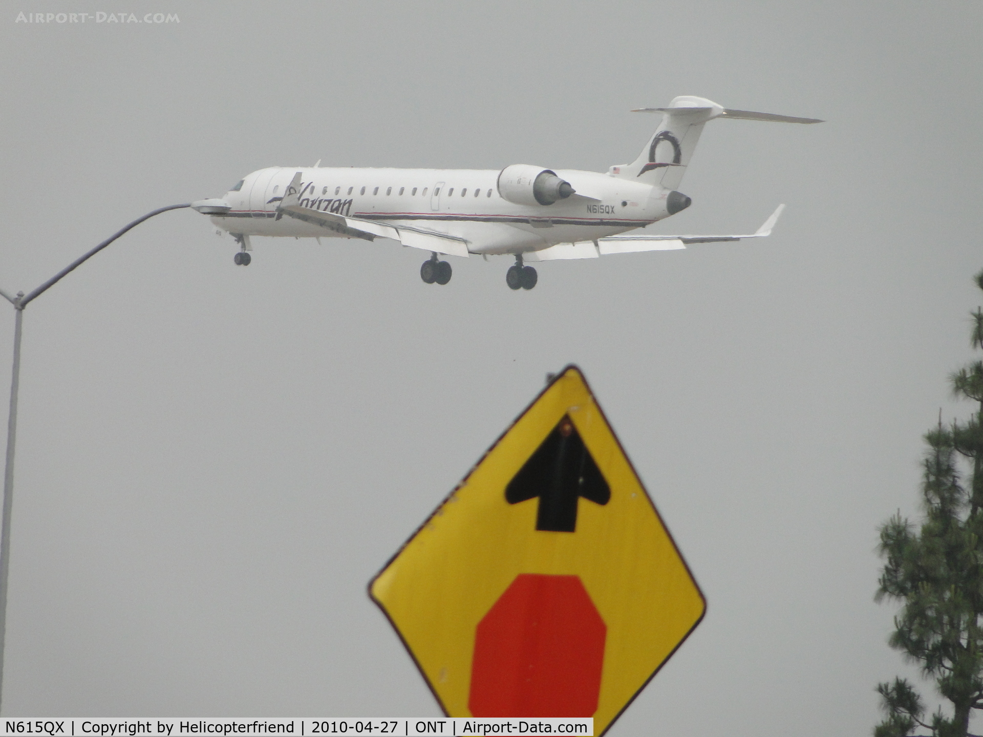 N615QX, 2002 Bombardier CRJ-701 (CL-600-2C10) Regional Jet C/N 10065, In the fog, refused to stop and looks like it almost hit the light