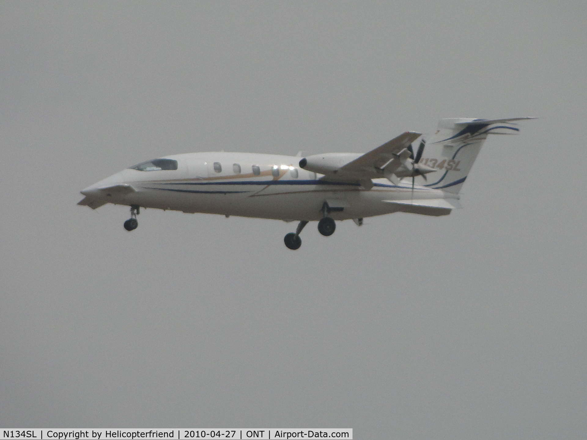 N134SL, Piaggio P-180 C/N 1100, On foggy final to runway 26R