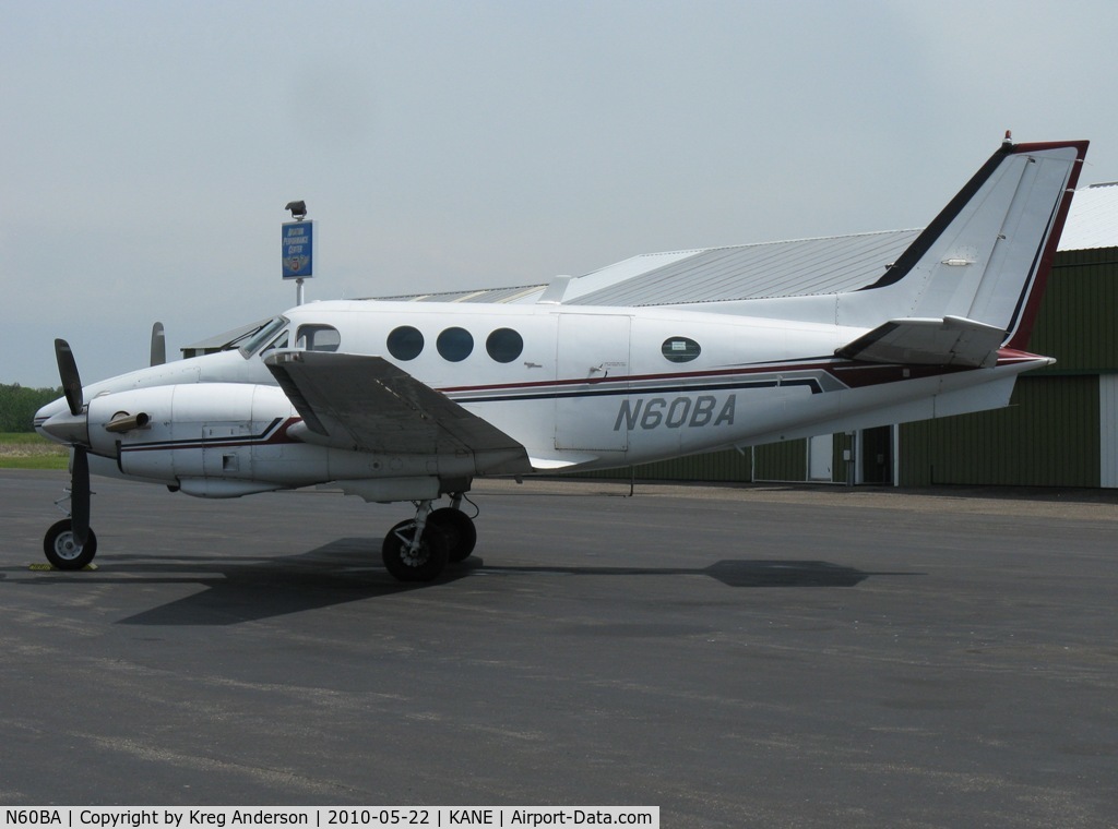 N60BA, Beech E-90 King Air C/N LW-79, Parked on a ramp by one of the FBOs.