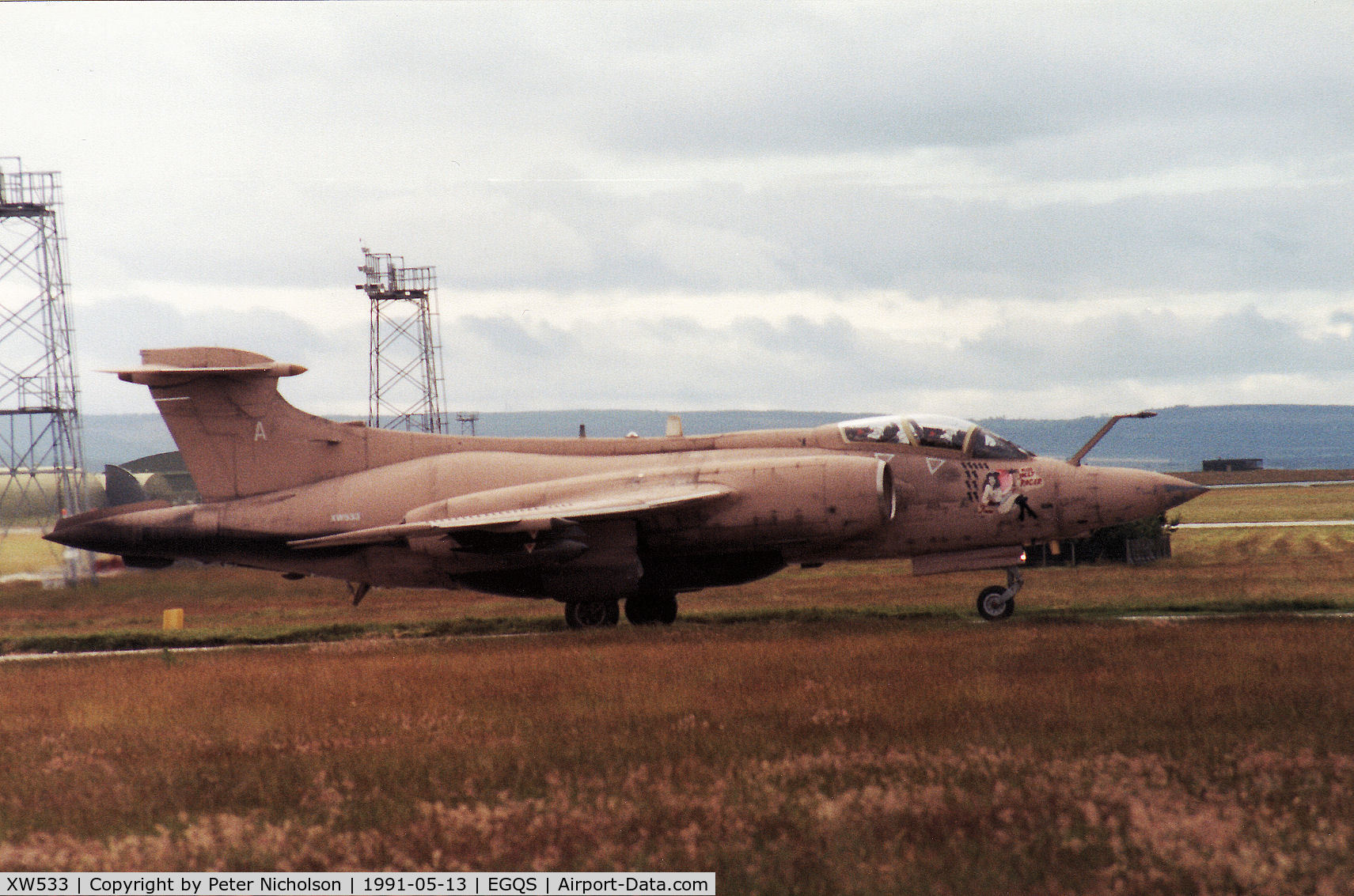 XW533, 1971 Hawker Siddeley Buccaneer S.2B C/N B3-02-70, Buccaneer S.2B of 237 Operational Conversion Unit waiting for clearance to join the active runway at Lossiemouth in May 1991 and wearing Gulf War markings of Fiona/Miss Jolly Roger.