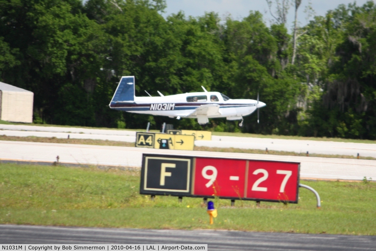 N1031M, 1989 Mooney M20M Bravo C/N 27-0005, Arriving at Lakeland, Florida during Sun N Fun 2010.