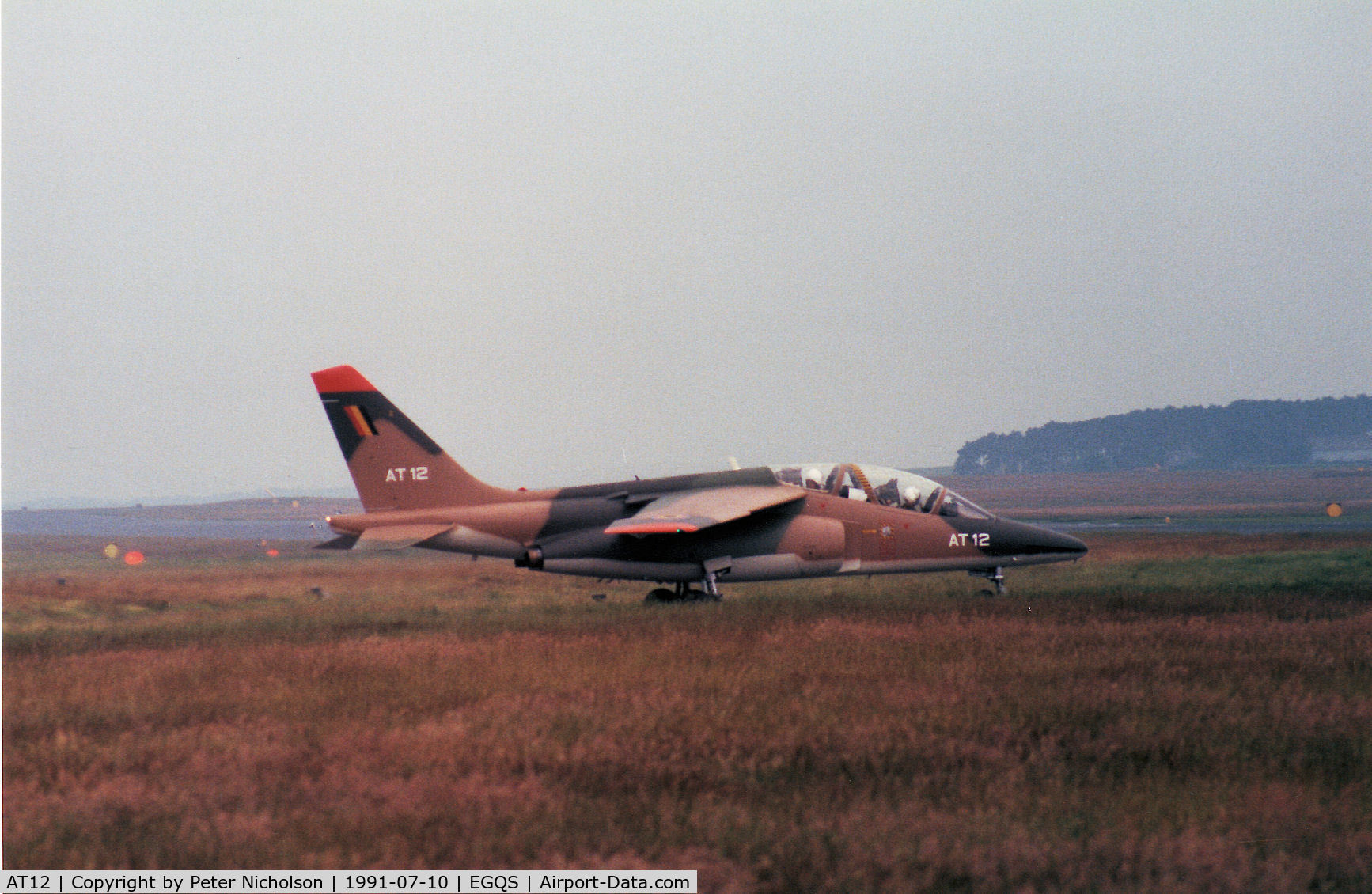 AT12, Dassault-Dornier Alpha Jet 1B C/N B12/1036, Alpha Jet of 9 Wing Belgian Air Force taxying to the active runway at RAF Lossiemouth ion the Summer of 1991.