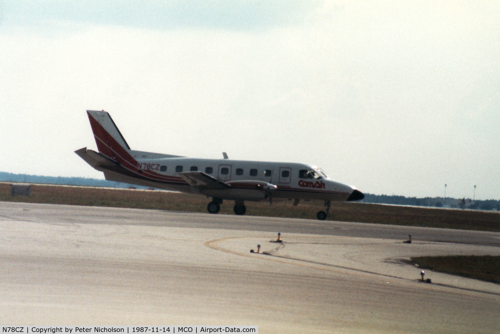 N78CZ, Embraer EMB-110P1 Bandeirante C/N 110358, Embraer Bandeirante of Comair taxying to the active runway at Orlando in November 1987.
