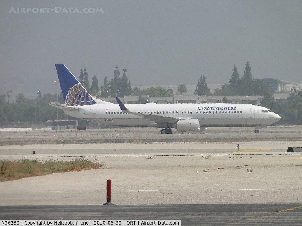 N36280, 2003 Boeing 737-824 C/N 31598, Rolled out from landing on runway 26R and now taxiing back to Terminal