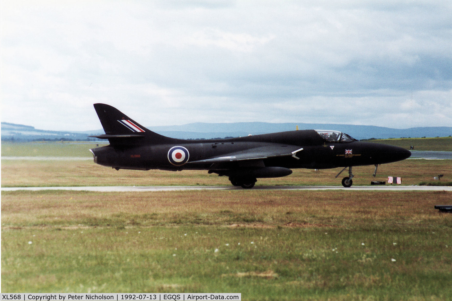 XL568, 1958 Hawker Hunter T.7A C/N 41H-693719, Hunter T.7A of 208 Squadron awaiting clearance to join the active runway at RAF Lossiemouth in the Summer of 1992.